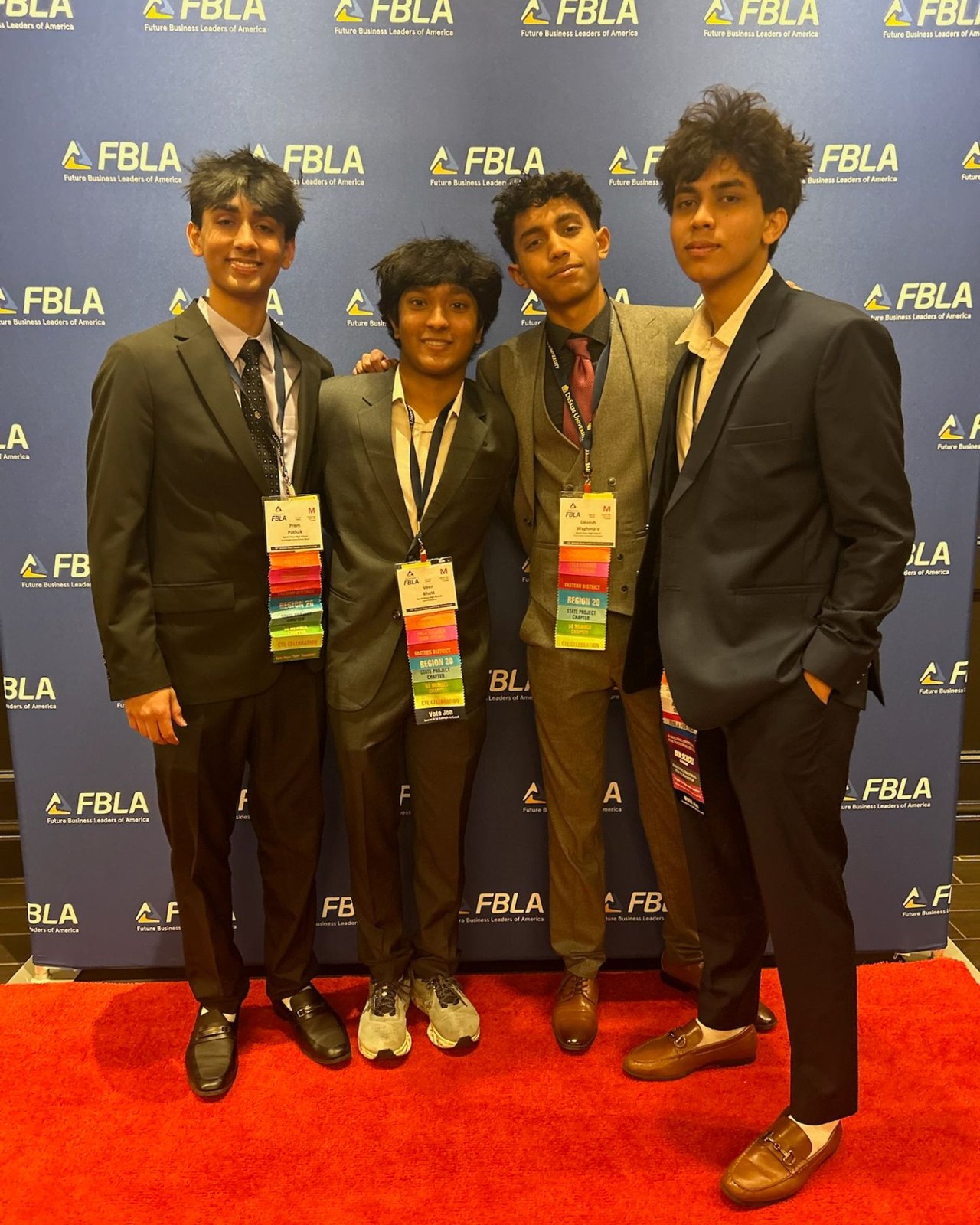 Members on the red carpet against the FBLA wall